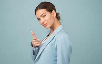 woman pointing her fingers like a gun